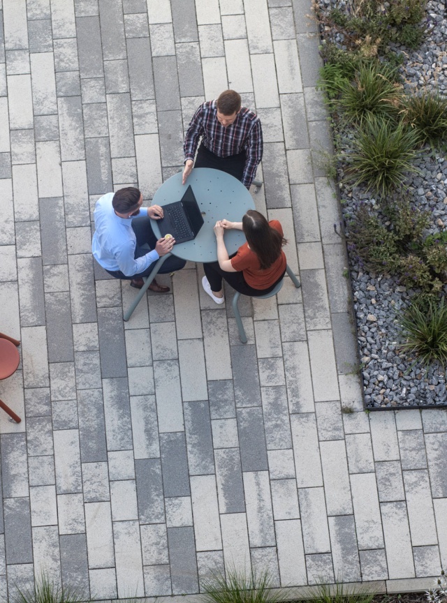 People photographed from above, sitting at a table.